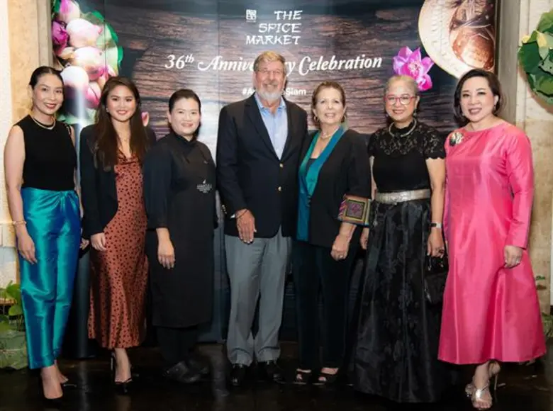 Mr. William E. Heinecke (4th left), found...