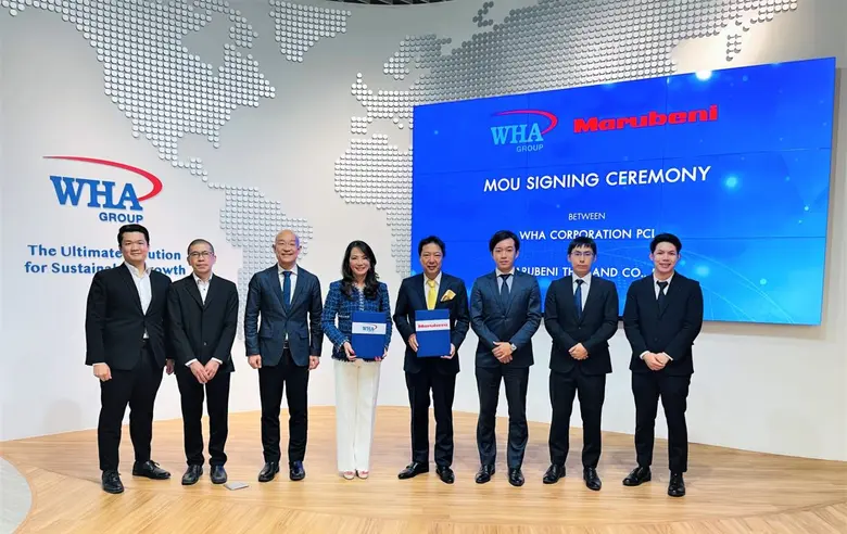 Ms. Jareeporn Jarukornsakul (center left)...